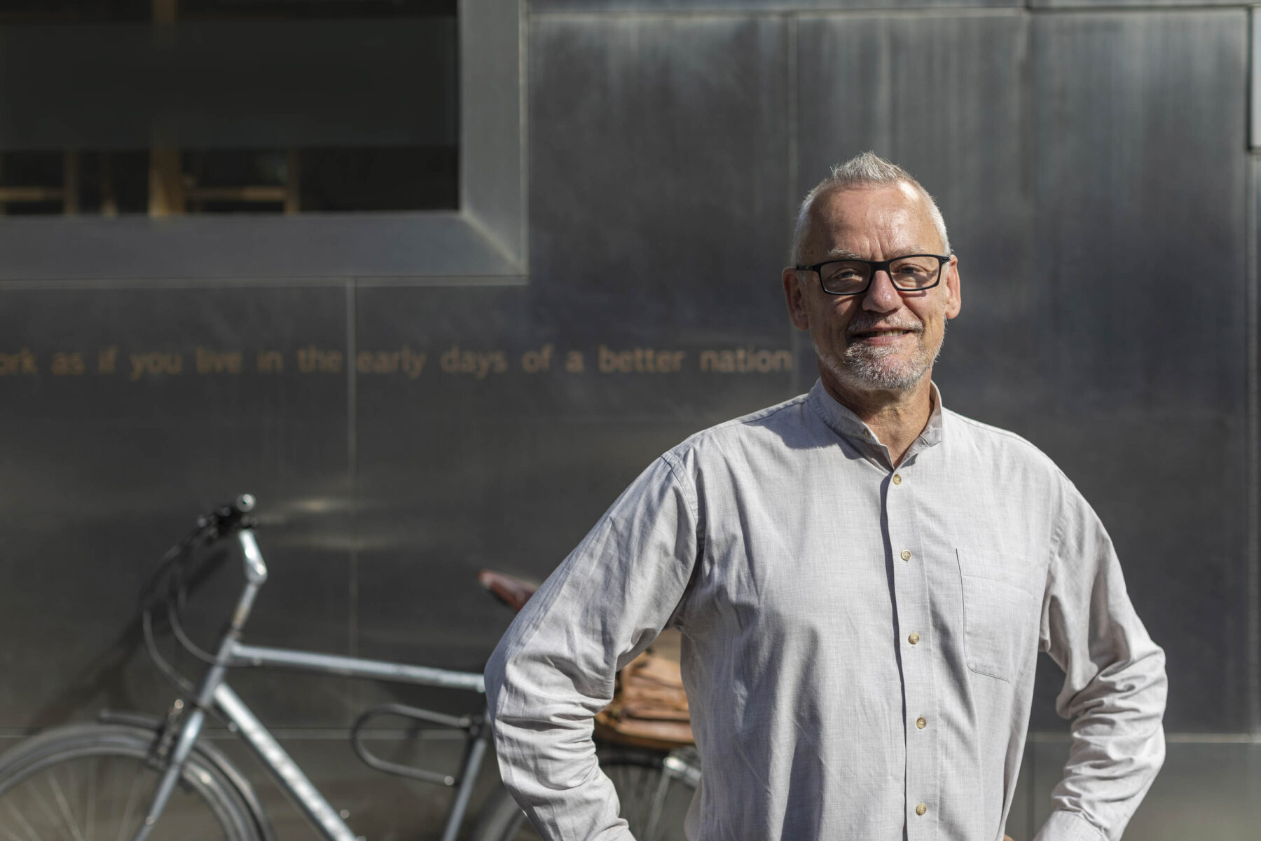 Malcolm Fraser, and his bike, in front of the Scottish Storytelling Centre, Edinburgh.
