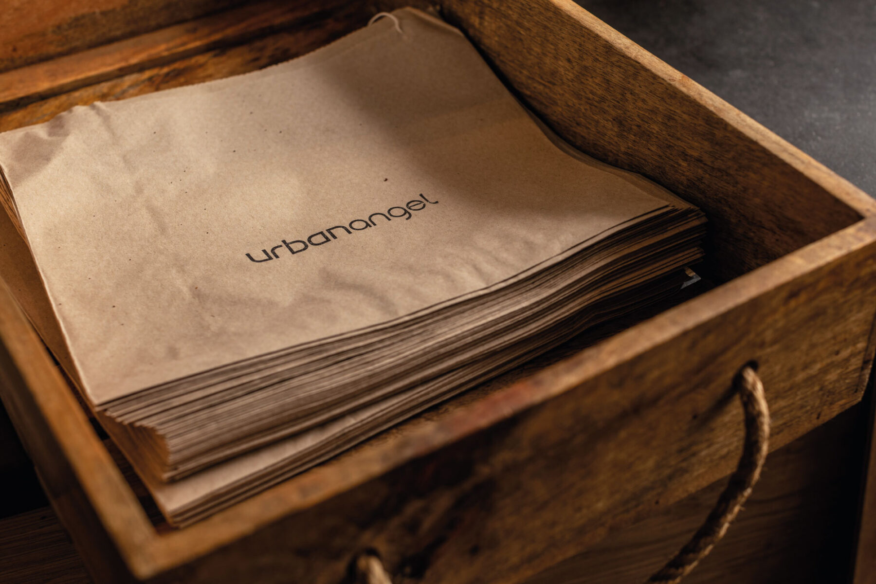 Urbanangel paper bags inside a wooden drawer.
